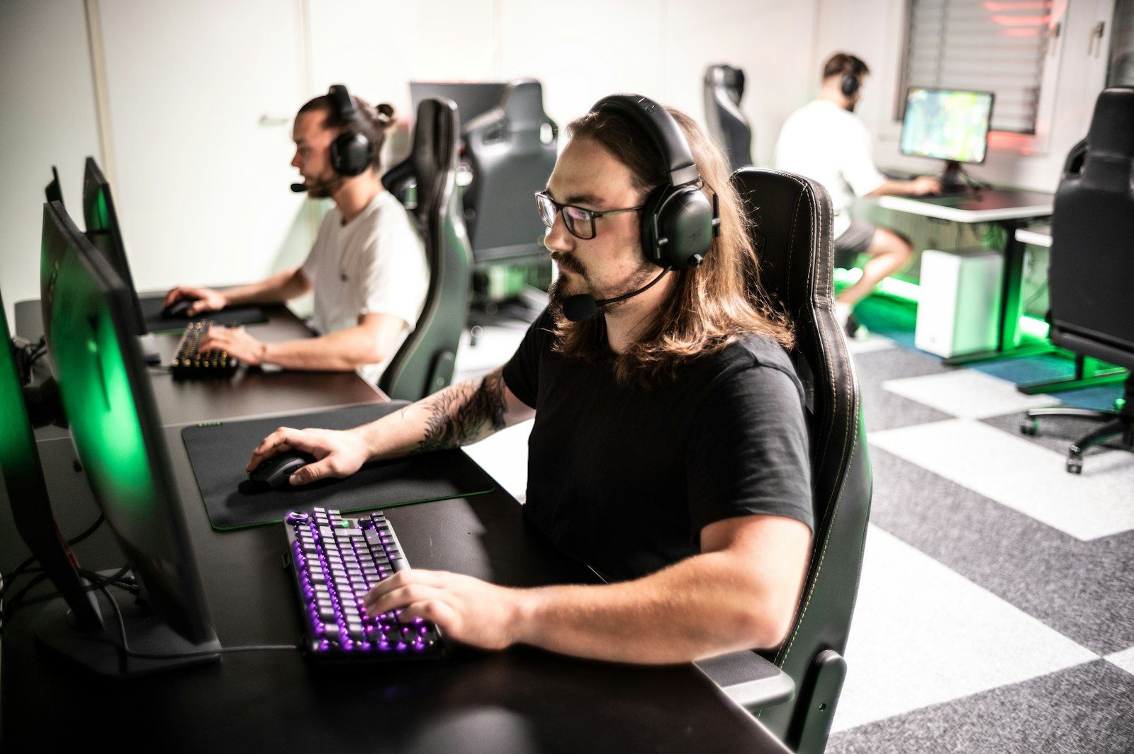 Adults playing video games together at a team event