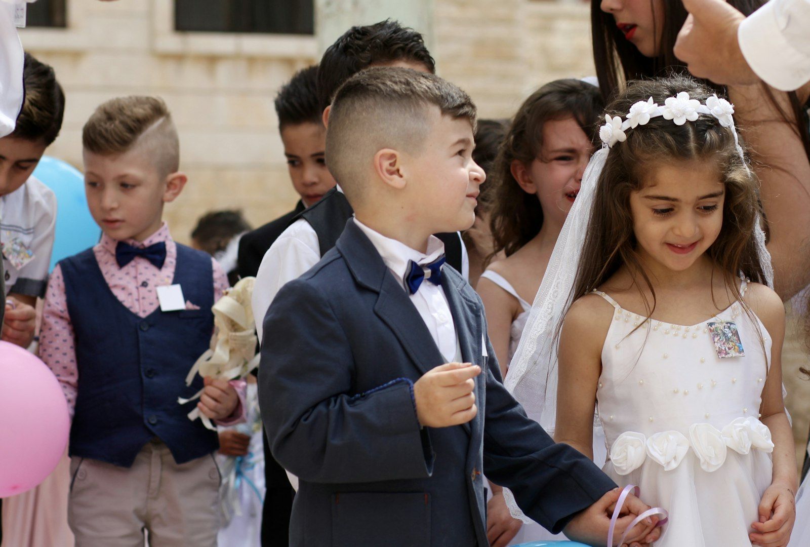 Children in formal clothes at a family celebration