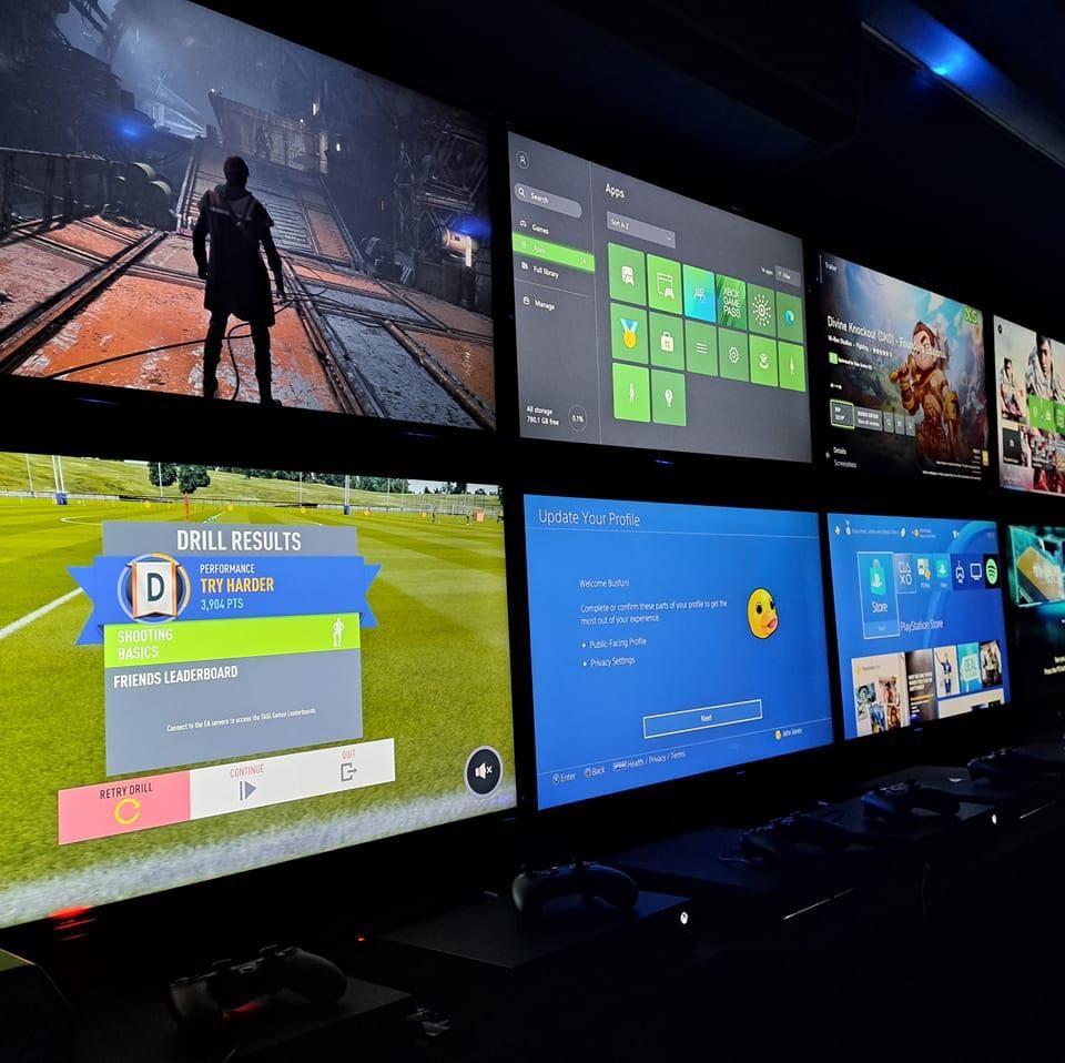 Inside the Game Bus: a bank of gaming screens lit up