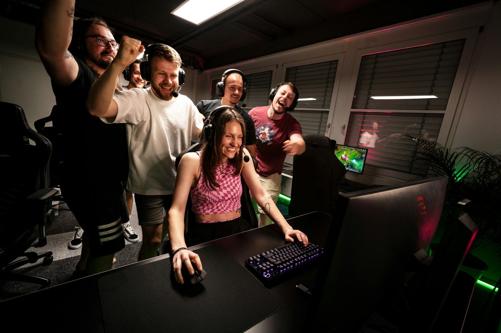 Group of young people cheering during a gaming session